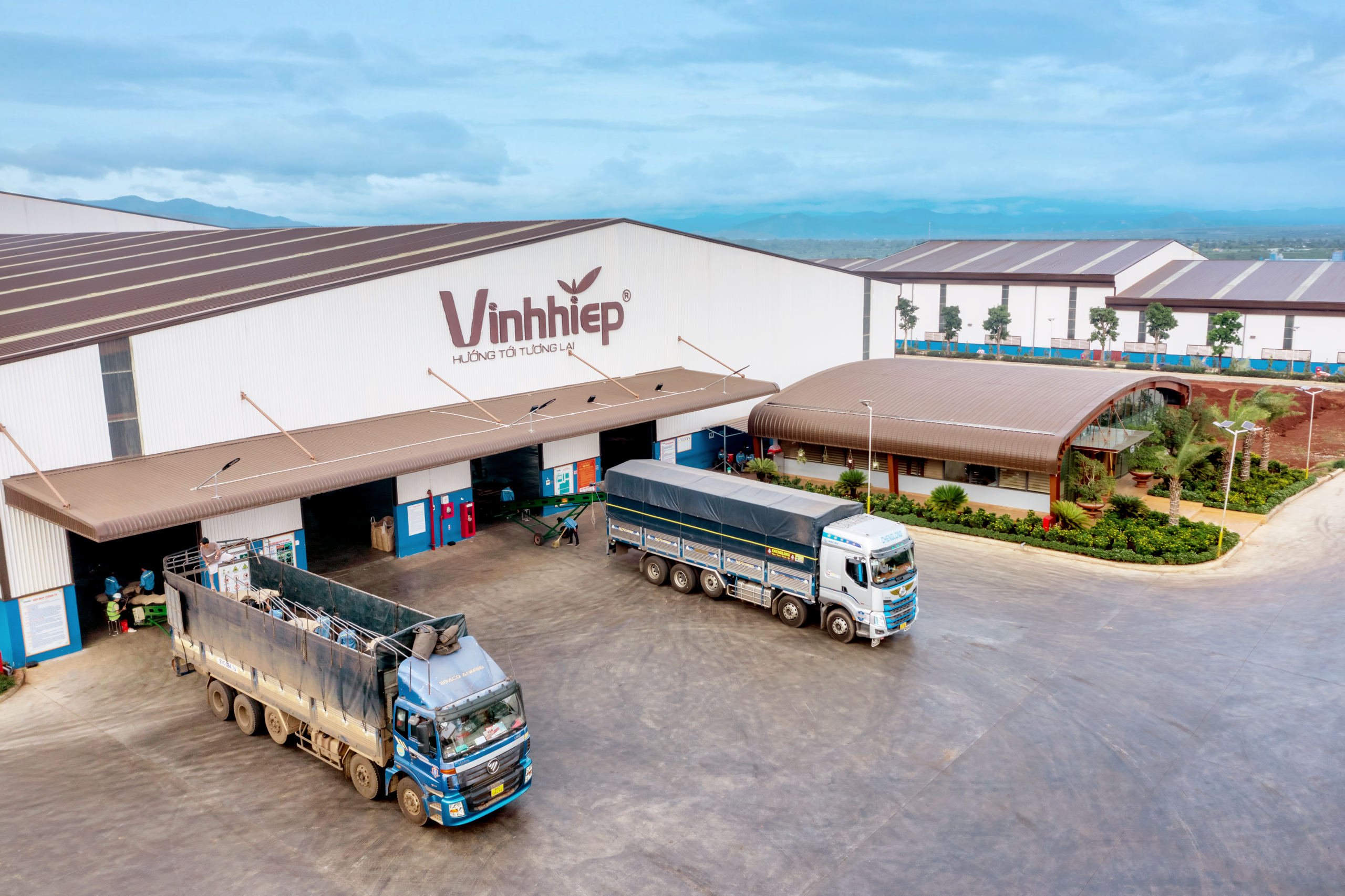 Trucks outside a coffee facility with loading areas